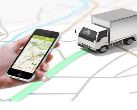 Mobile phone displaying a route map next to a delivery truck, illustrating route optimization software that uses GIS mapping and real-time traffic data for efficient logistics and transportation solutions.