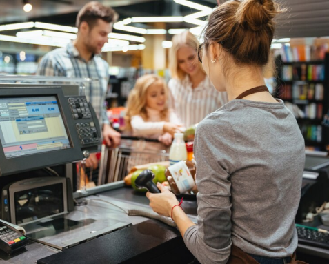 Business professional using a tablet with digital icons representing e-commerce and logistics, symbolizing offshore software development services that enhance operations, customer engagement, and revenue growth in the e-commerce and retail sector.