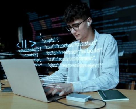 A developer working on a laptop with code overlaid on the image, symbolizing Samyak Infotech's AngularJS API development services that ensure robust and secure communication between systems using technologies like Node.js, Python, and Java.