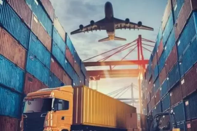 Shipping containers with a truck and airplane in the background, representing Samyak Infotech's development of an AngularJS-based logistics management system for real-time tracking, inventory management, and route optimization, improving operational efficiency for a logistics company.