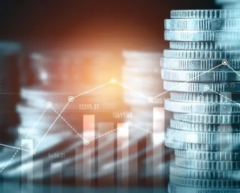 Stacks of coins with a rising line graph overlay, representing the use of machine learning in finance and banking for fraud detection, risk management, algorithmic trading, and process automation to enhance efficiency and decision-making.