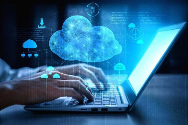 Hands typing on a laptop with a digital cloud icon hovering above, representing the use of cloud management services in DevOps consulting to reduce cloud costs and improve performance for a global retail chain.